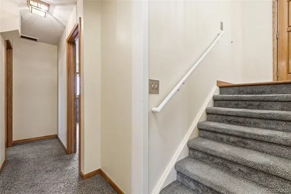 a view of a livingroom with furniture and a window