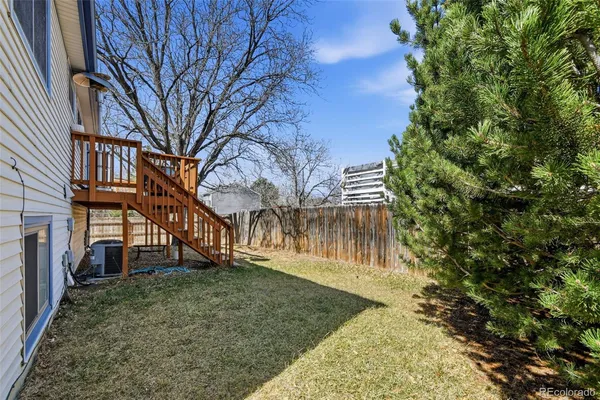 a view of house with yard and entertaining space