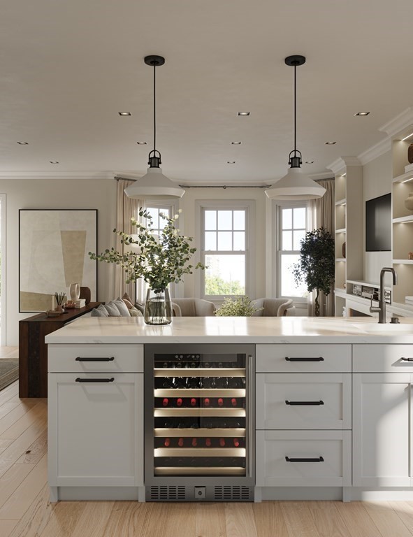 33 Boardman Street, Unit 2 Boston, MA 02128 - Photo 2 of 8 a kitchen with a sink and dishwasher with white cabinets