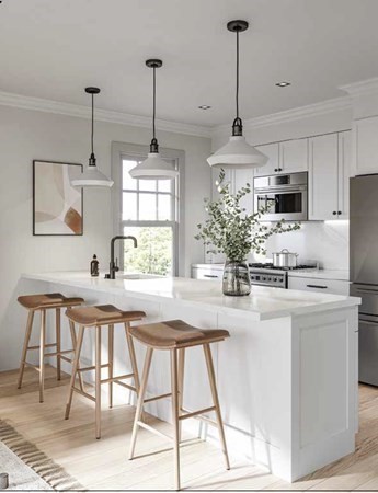 33 Boardman Street, Unit 2 Boston, MA 02128 - Photo 4 of 8 a kitchen with stainless steel appliances kitchen island granite countertop a dining table chairs and white cabinets
