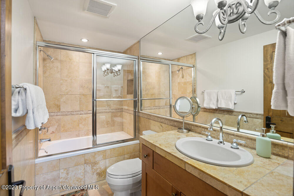 64 Eastwood Road Aspen, CO 81611 - Photo 19 of 24 a bathroom with a sink a toilet and shower