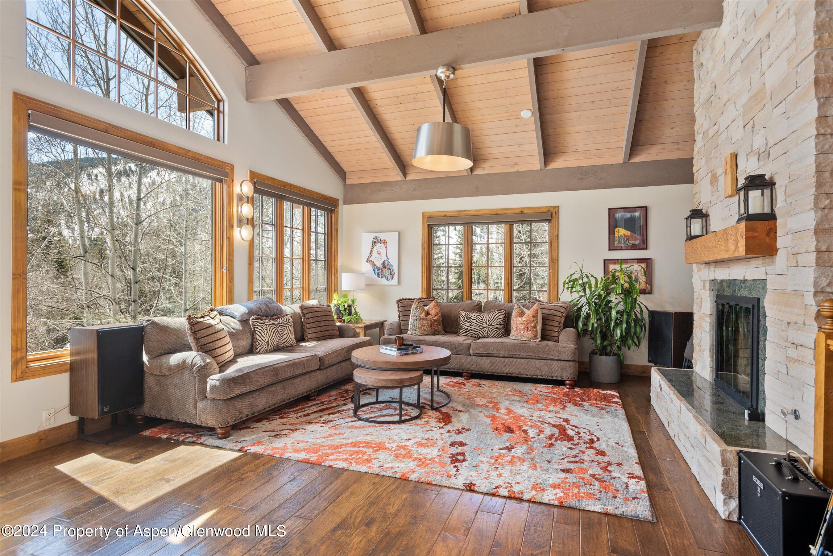 64 Eastwood Road Aspen, CO 81611 - Photo 7 of 24 a living room with furniture large window and wooden floor