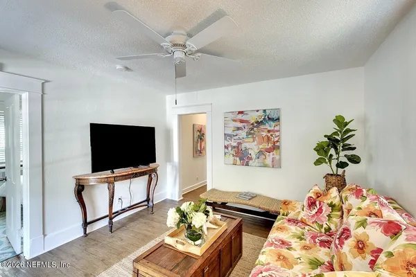 a living room with furniture and a flat screen tv