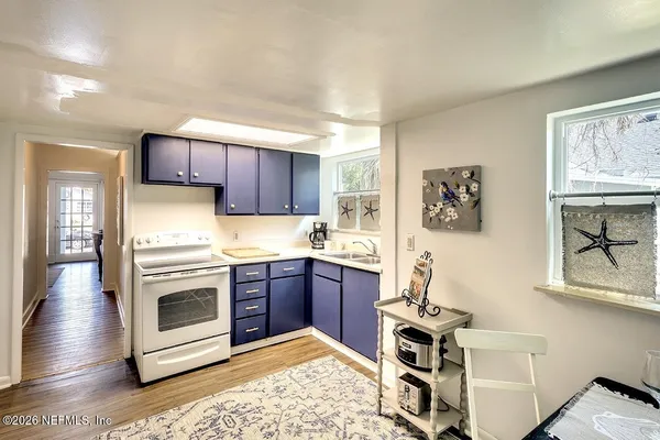 a kitchen with stainless steel appliances granite countertop a stove and a sink