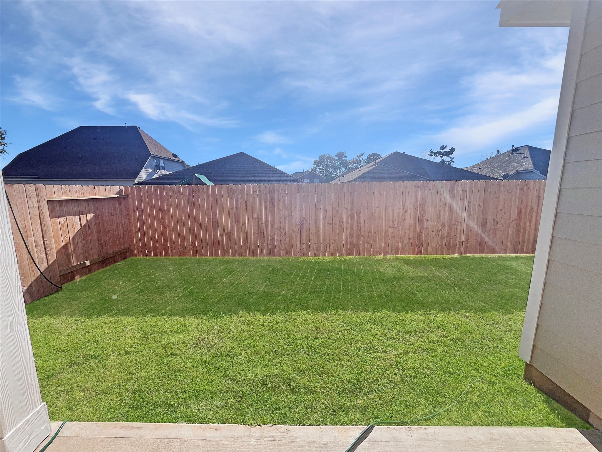 9749 Enclave Ridge Road Willis, TX 77318 - Photo 17 of 26 The Robin II- Rear Covered Patio into Yard