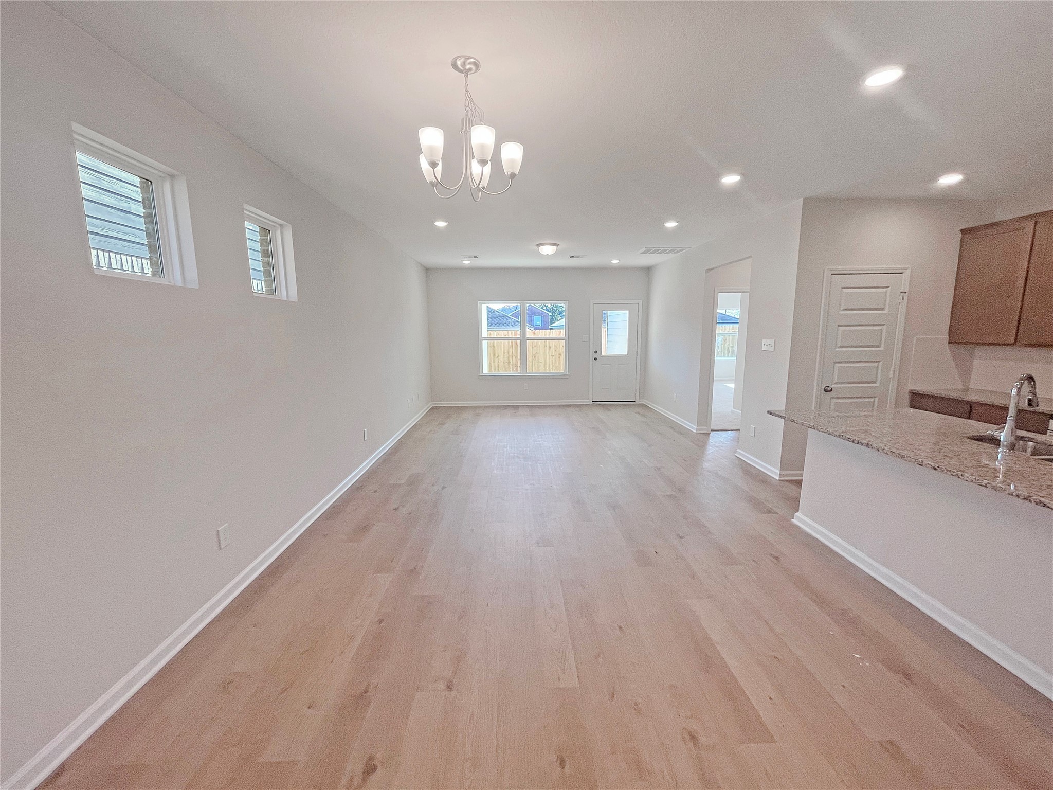 9749 Enclave Ridge Road Willis, TX 77318 - Photo 4 of 26 The Robin II- Dining Area into Family Room