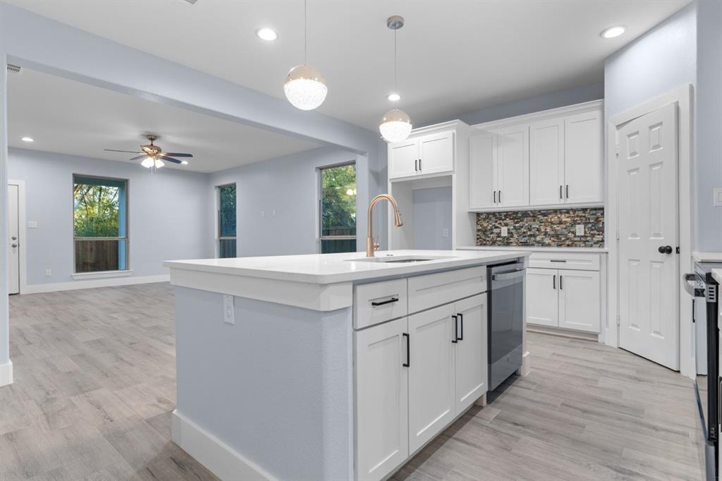 520 East 5th Street Bonham, TX 75418 - Photo 5 of 16 a bathroom with a sink vanity and a mirror