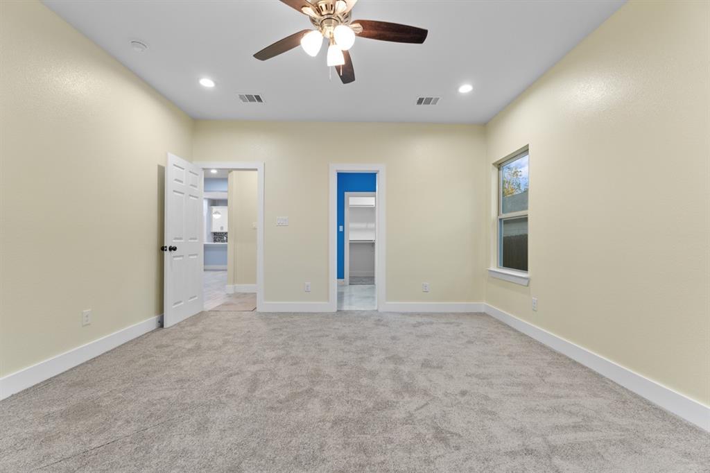 520 East 5th Street Bonham, TX 75418 - Photo 6 of 16 an empty room with fan and entrance