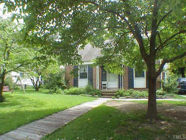 706 Edmund Street Raleigh, NC 27604 - Photo 1 of 1 a front view of a house with garden