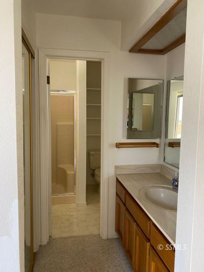 718 North Inyo Street Ridgecrest, CA 93555 - Photo 8 of 9 a bathroom with a sink and a mirror