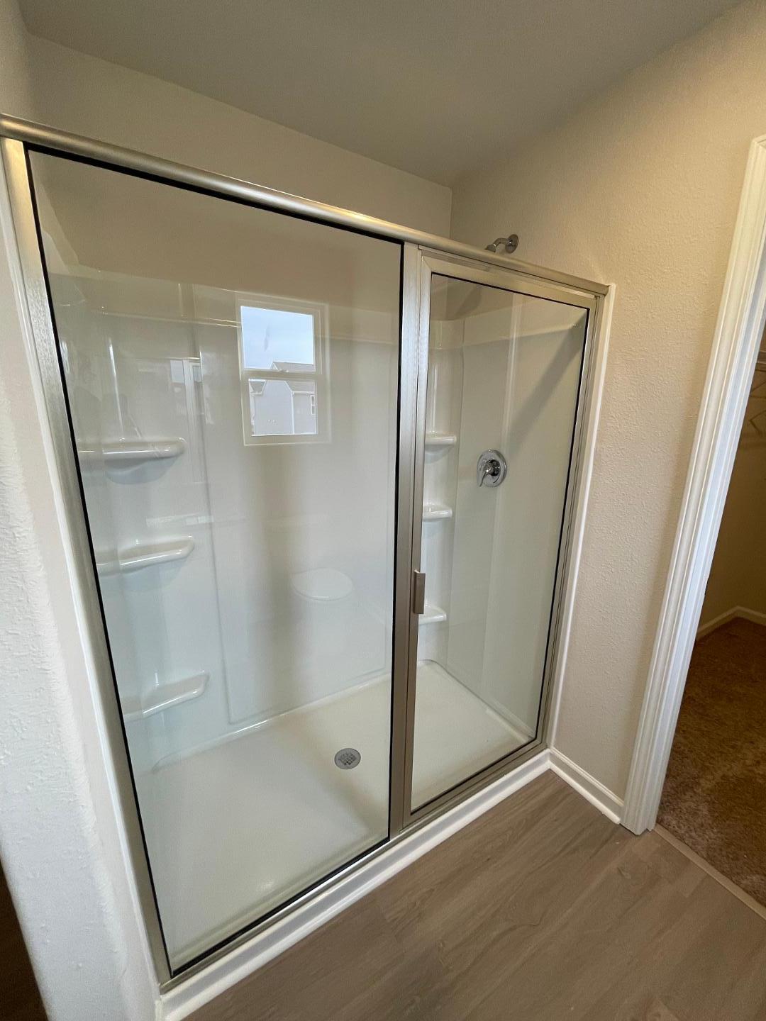 111 Hybrid Street Oxford, NC 27565 - Photo 22 of 25 a bathroom with a glass shower door