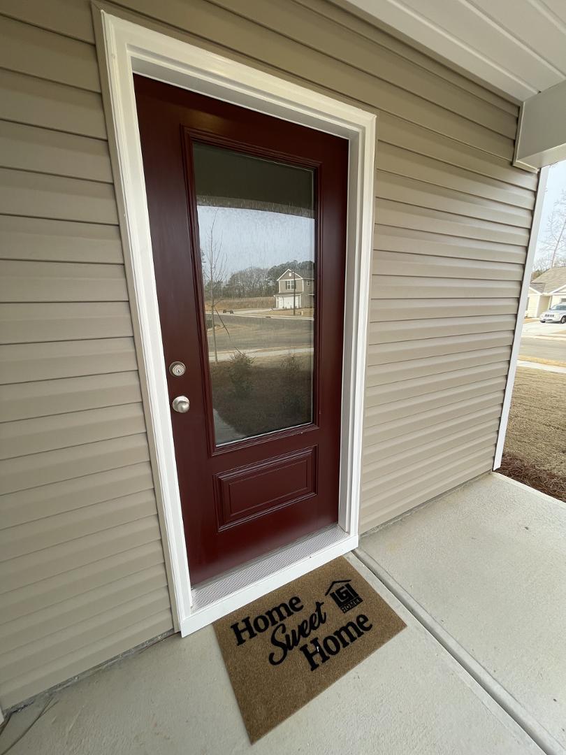 111 Hybrid Street Oxford, NC 27565 - Photo 3 of 25 a view of a entryway door of the house