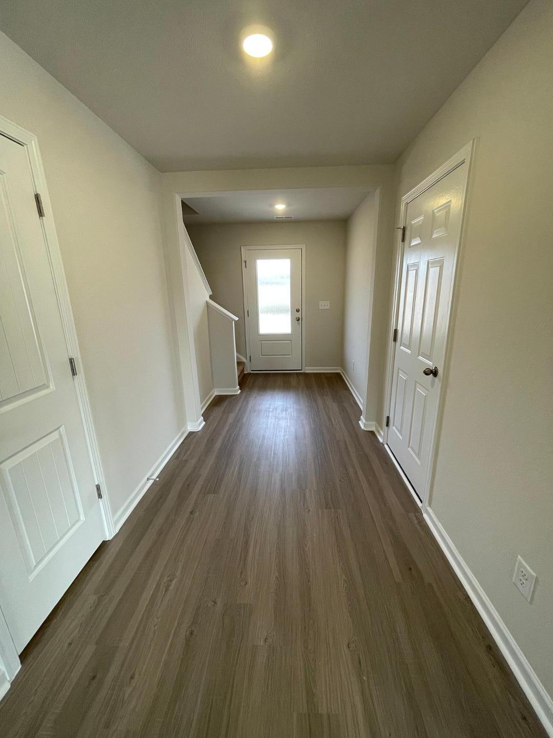 111 Hybrid Street Oxford, NC 27565 - Photo 4 of 25 an empty room with wooden floor and windows