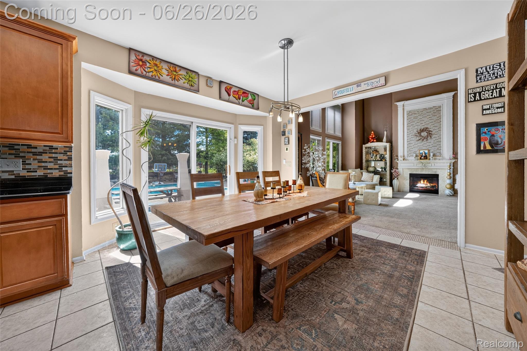 2619 Lambeth Park Rochester, MI 48306 - Photo 24 of 71 Dining area featuring a wood-finish table and bench seating