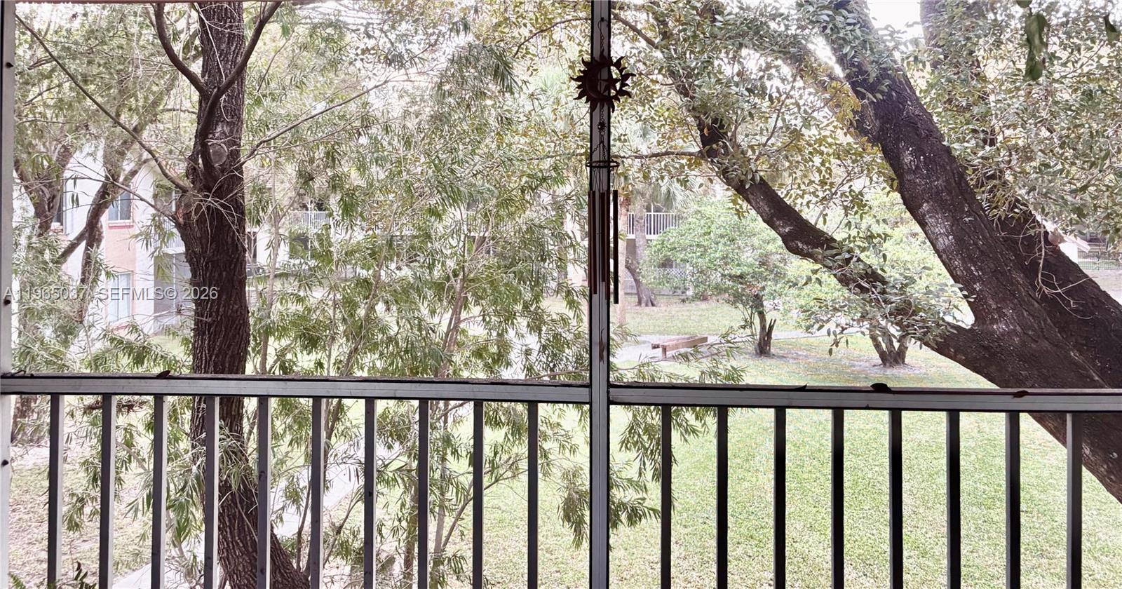 9081 Southwest 138th Place, Unit 9081 Miami, FL 33186 - Photo 6 of 20 a view of trees and trees from a balcony