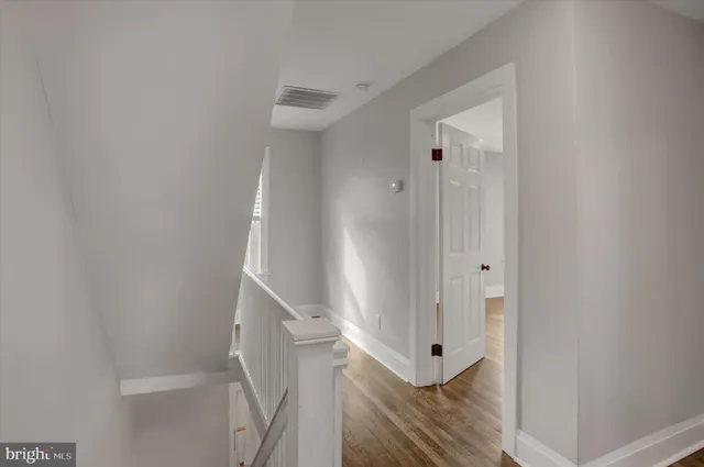 a view of a hallway with staircase