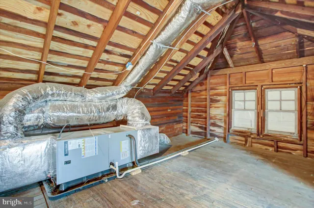a view of a room with wooden walls
