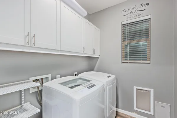 a utility room with dryer and washer