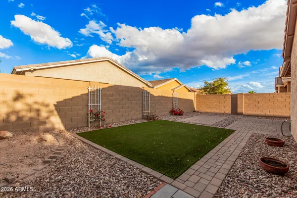a view of a backyard with sitting area