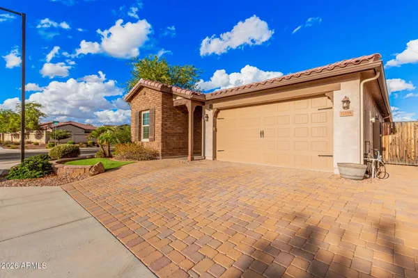 a view of a house with a yard and garage