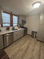 36 St Marks Road, Unit 2 Boston, MA 02124 - Photo 5 of 14 a kitchen with sink cabinets and window