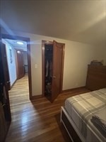 36 St Marks Road, Unit 2 Boston, MA 02124 - Photo 10 of 14 a bedroom with a bed and wooden floor