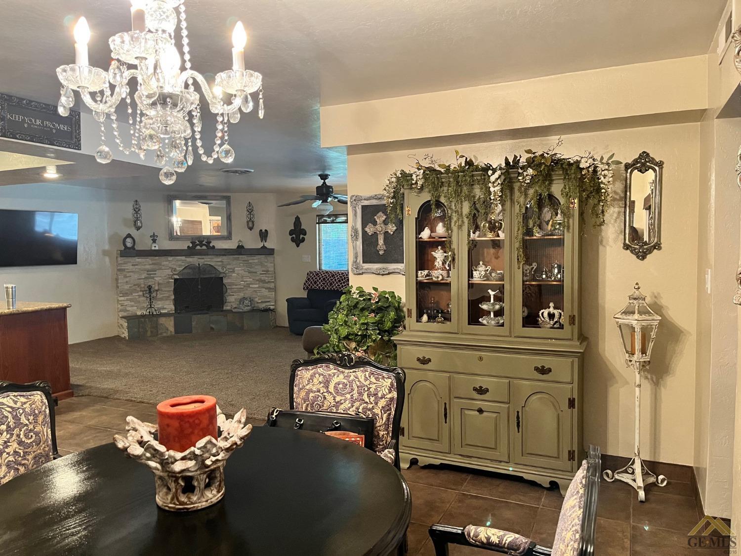 Undisclosed Address Bakersfield, CA 93309 - Photo 12 of 28 a living room with furniture and chandelier