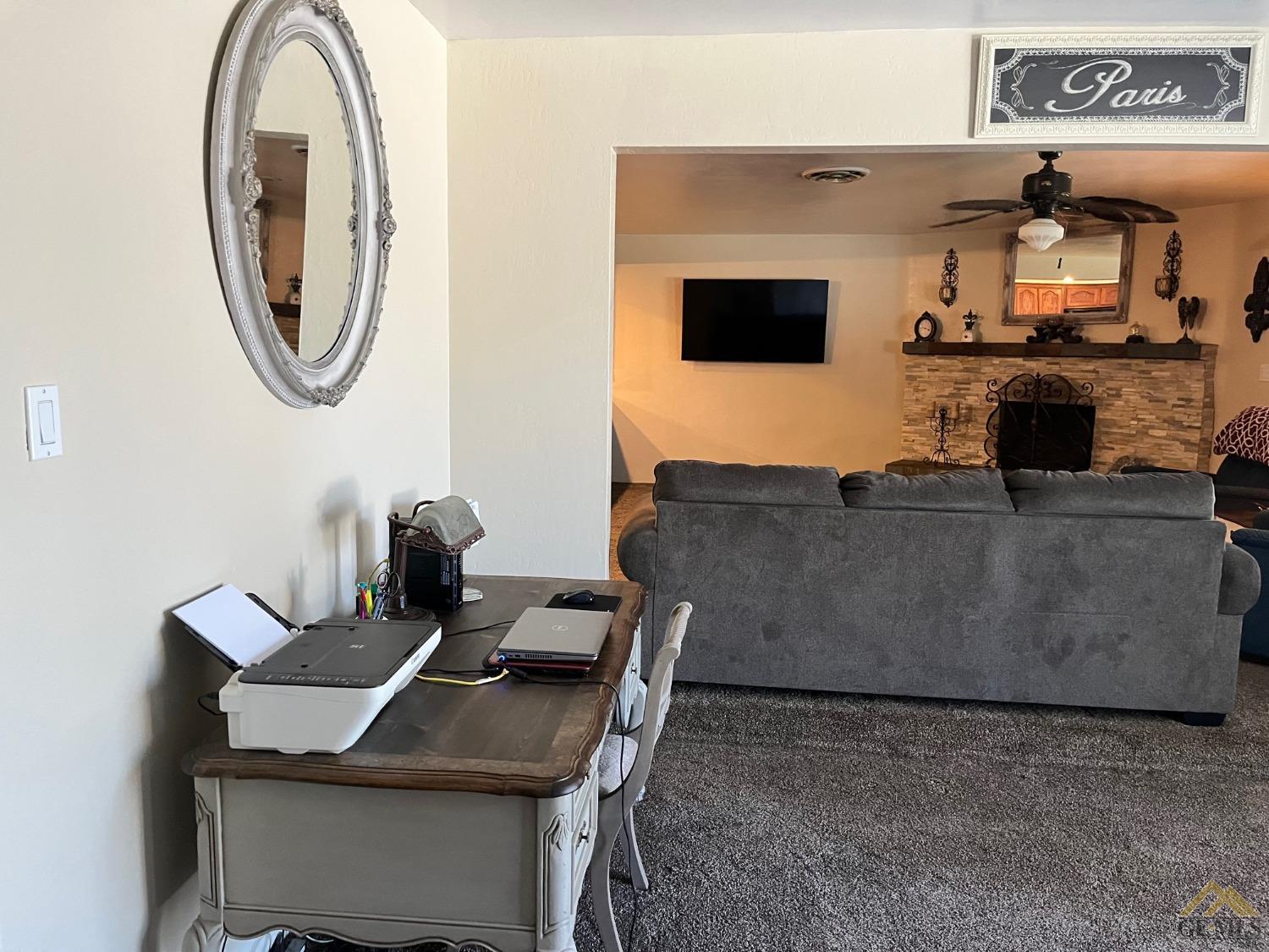 Undisclosed Address Bakersfield, CA 93309 - Photo 15 of 28 a living room with furniture and a fireplace