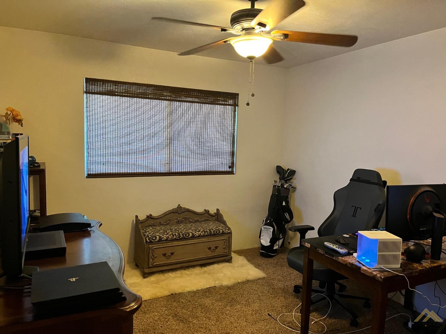 Undisclosed Address Bakersfield, CA 93309 - Photo 18 of 28 a living room with furniture and a window