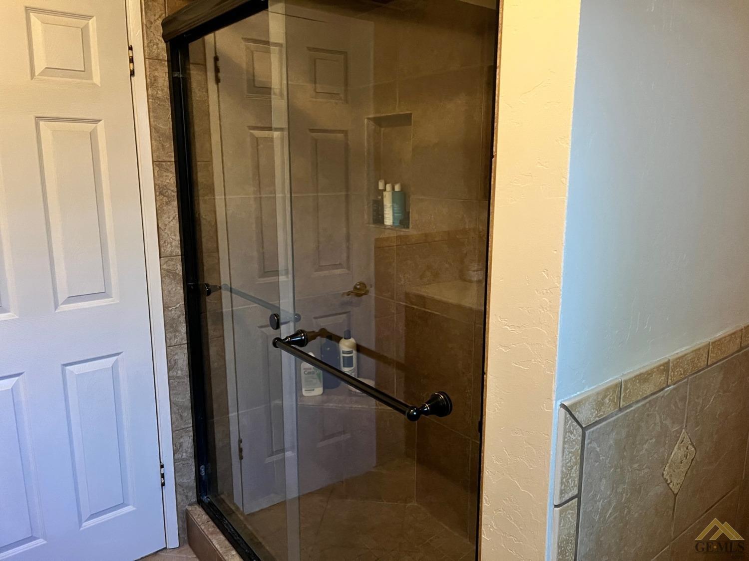 Undisclosed Address Bakersfield, CA 93309 - Photo 20 of 28 a bathroom with a shower