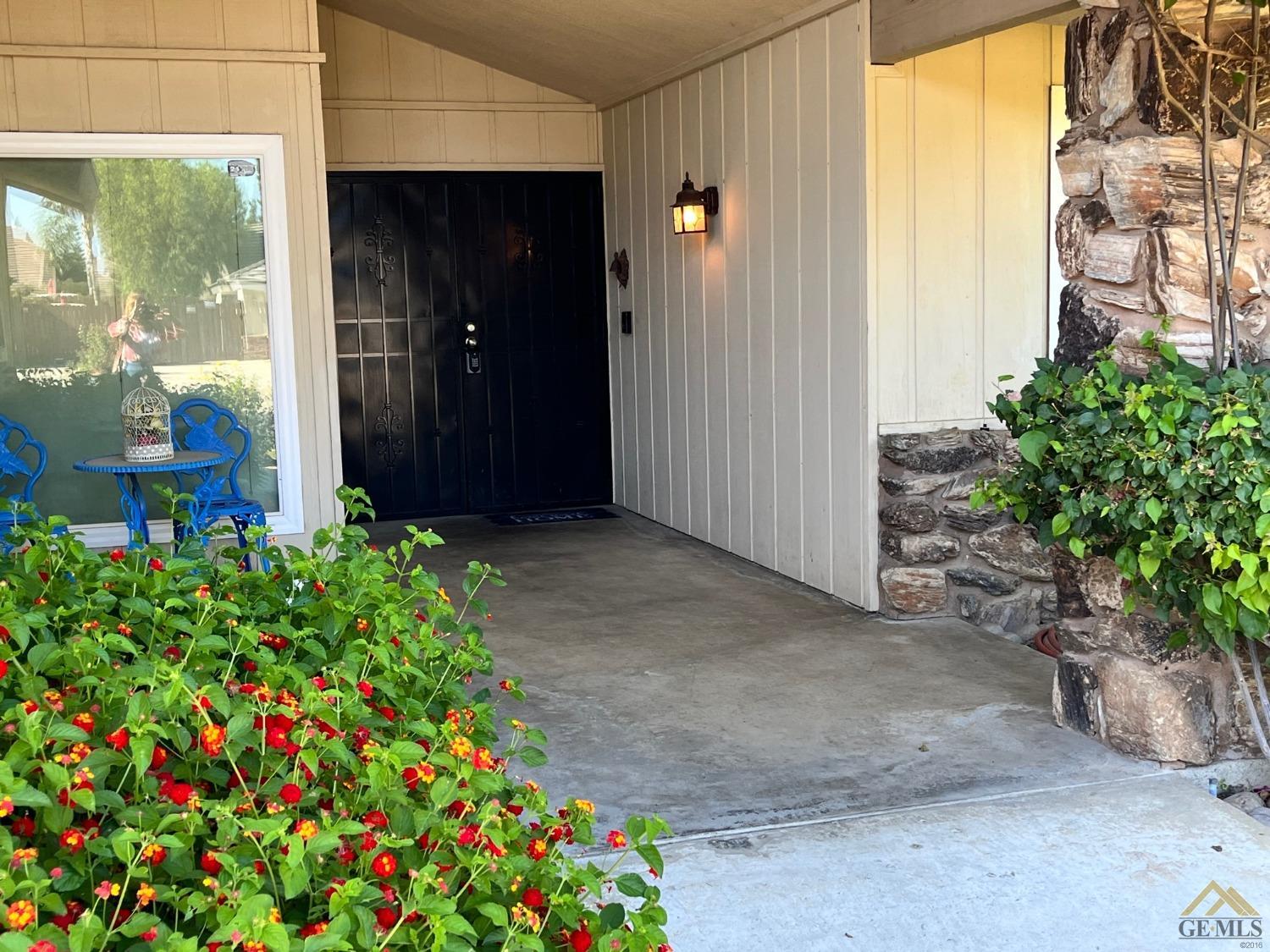 Undisclosed Address Bakersfield, CA 93309 - Photo 2 of 28 a view of a garden with flowers