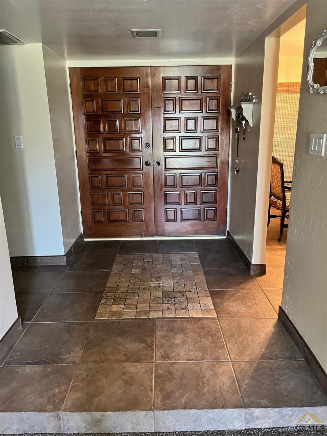 Undisclosed Address Bakersfield, CA 93309 - Photo 4 of 28 a view of entryway with a front door