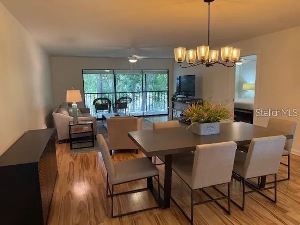 a balcony with table and chairs