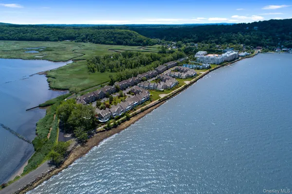 a view of a city and mountains ocean view