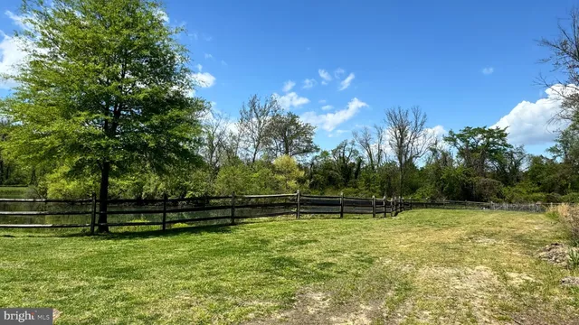 a view of outdoor space with deck and yard