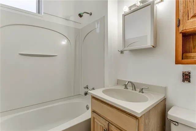 a bathroom with a sink and a bathtub