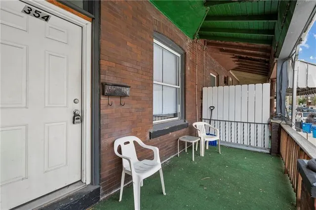 a patio with table and chairs