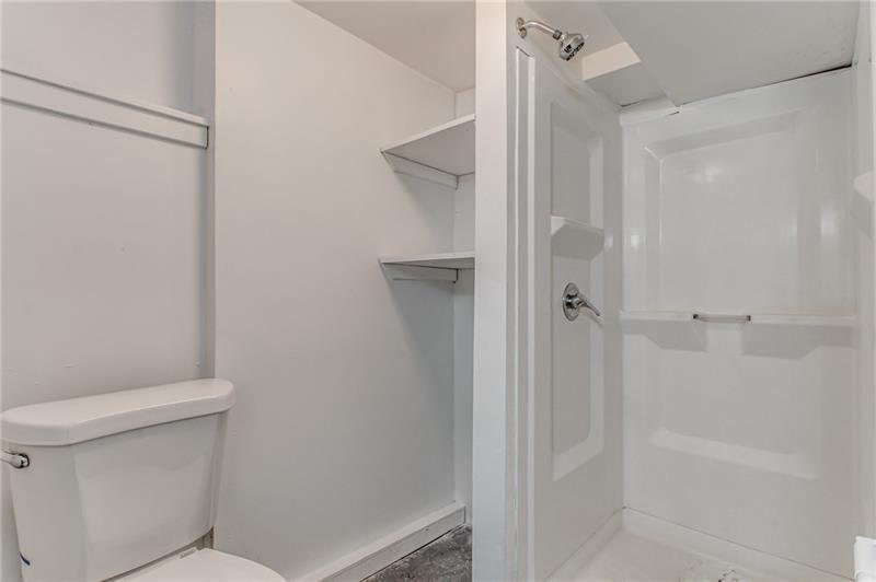 354 Ophelia Street Pittsburgh, PA 15213 - Photo 24 of 28 a bathroom with a shower and a toilet