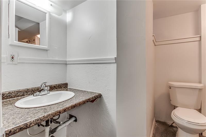 354 Ophelia Street Pittsburgh, PA 15213 - Photo 25 of 28 a bathroom with a sink toilet and mirror