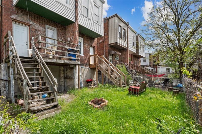354 Ophelia Street Pittsburgh, PA 15213 - Photo 28 of 28 a backyard of a house with lots of green space