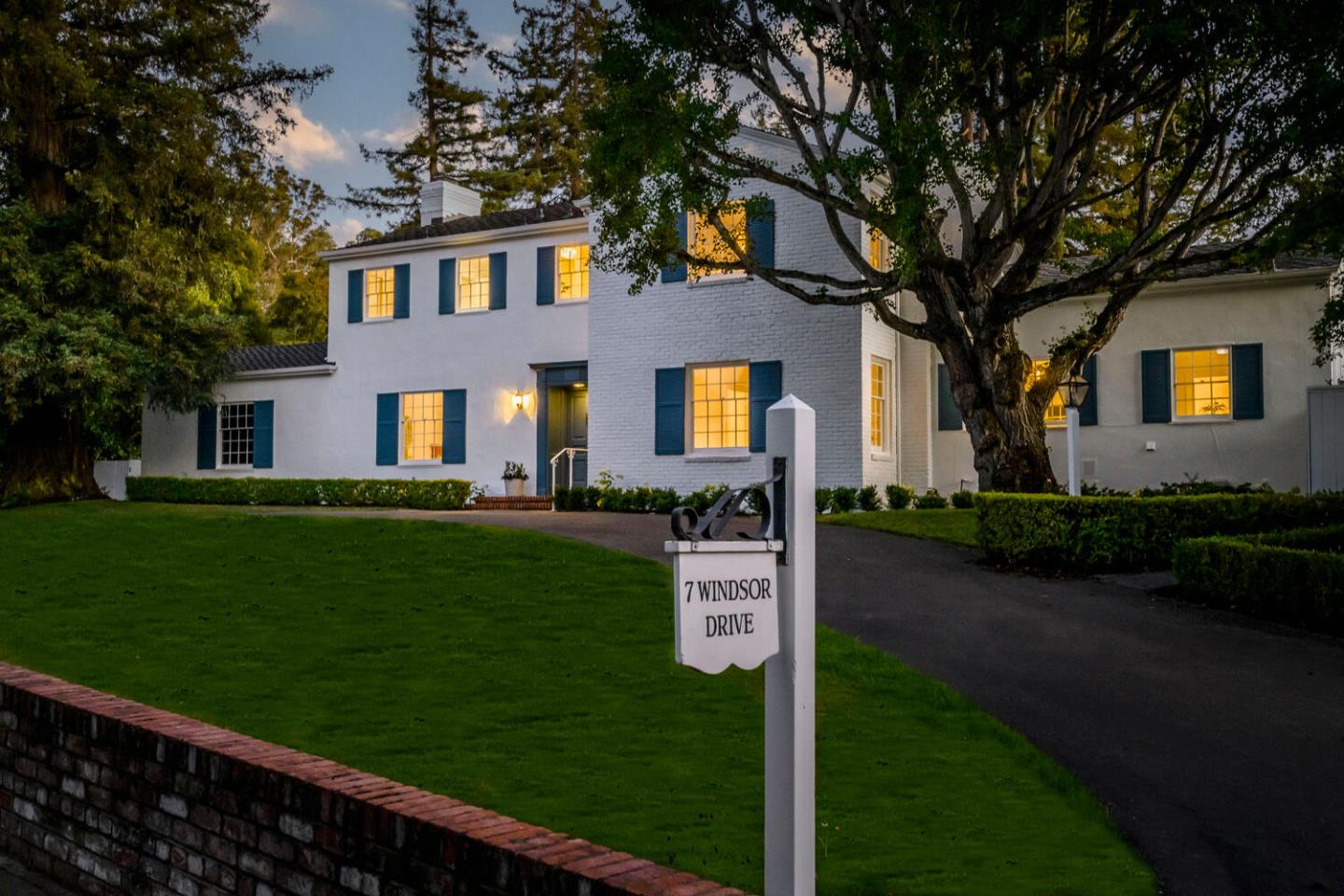 7 Windsor Drive Hillsborough, CA 94010 - Photo 1 of 57 a front view of a house with a garden and yard