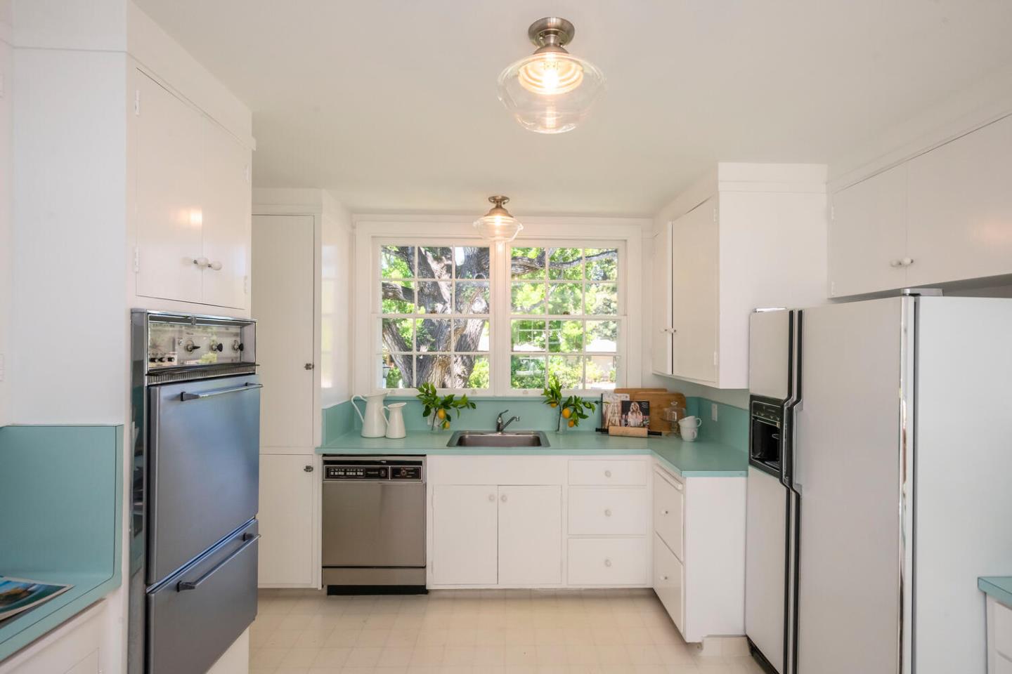 7 Windsor Drive Hillsborough, CA 94010 - Photo 16 of 57 a kitchen with a refrigerator and a stove