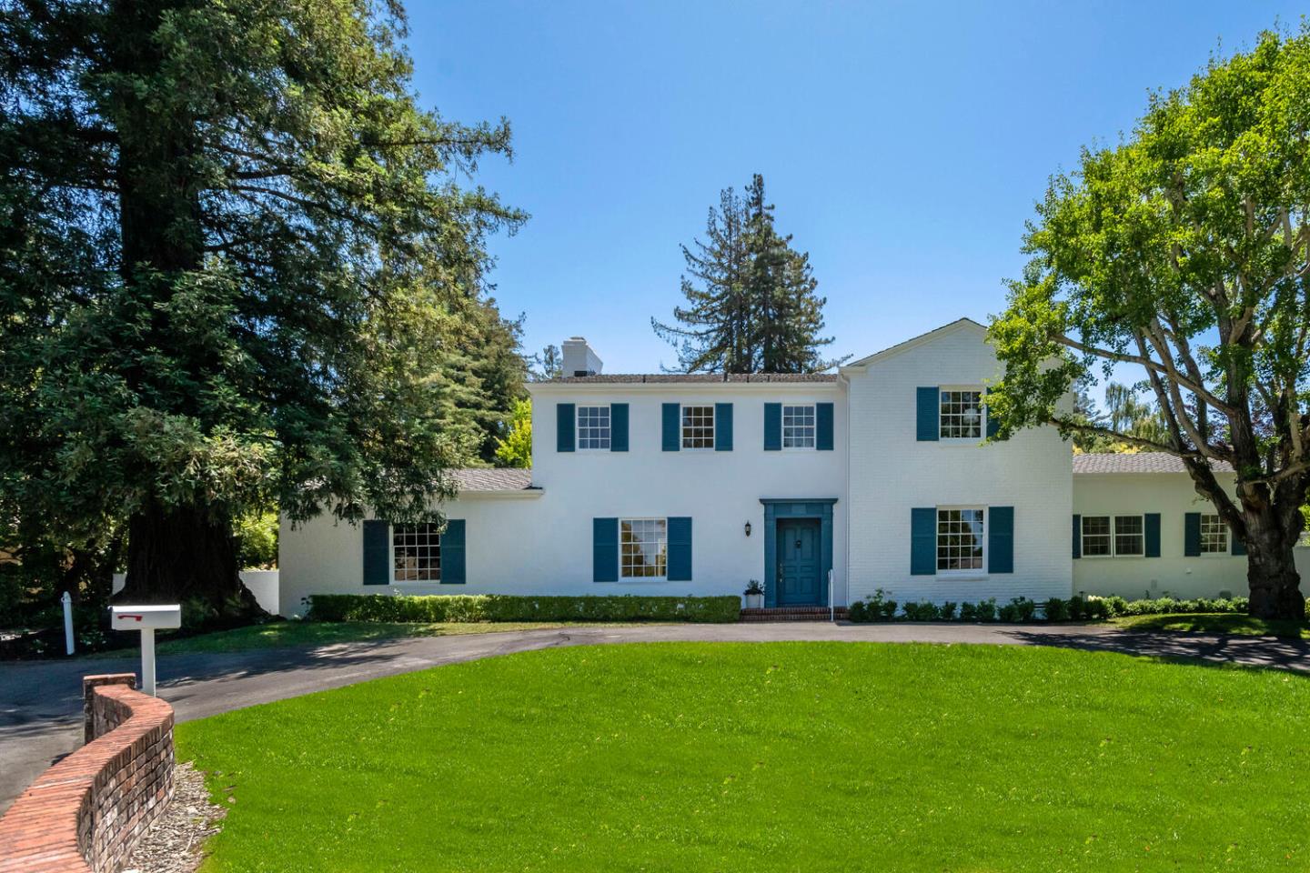 7 Windsor Drive Hillsborough, CA 94010 - Photo 2 of 57 a front view of house with yard and green space