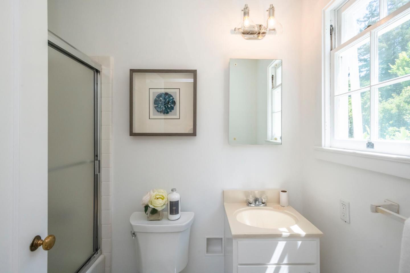 7 Windsor Drive Hillsborough, CA 94010 - Photo 22 of 57 a bathroom with a sink mirror and toilet