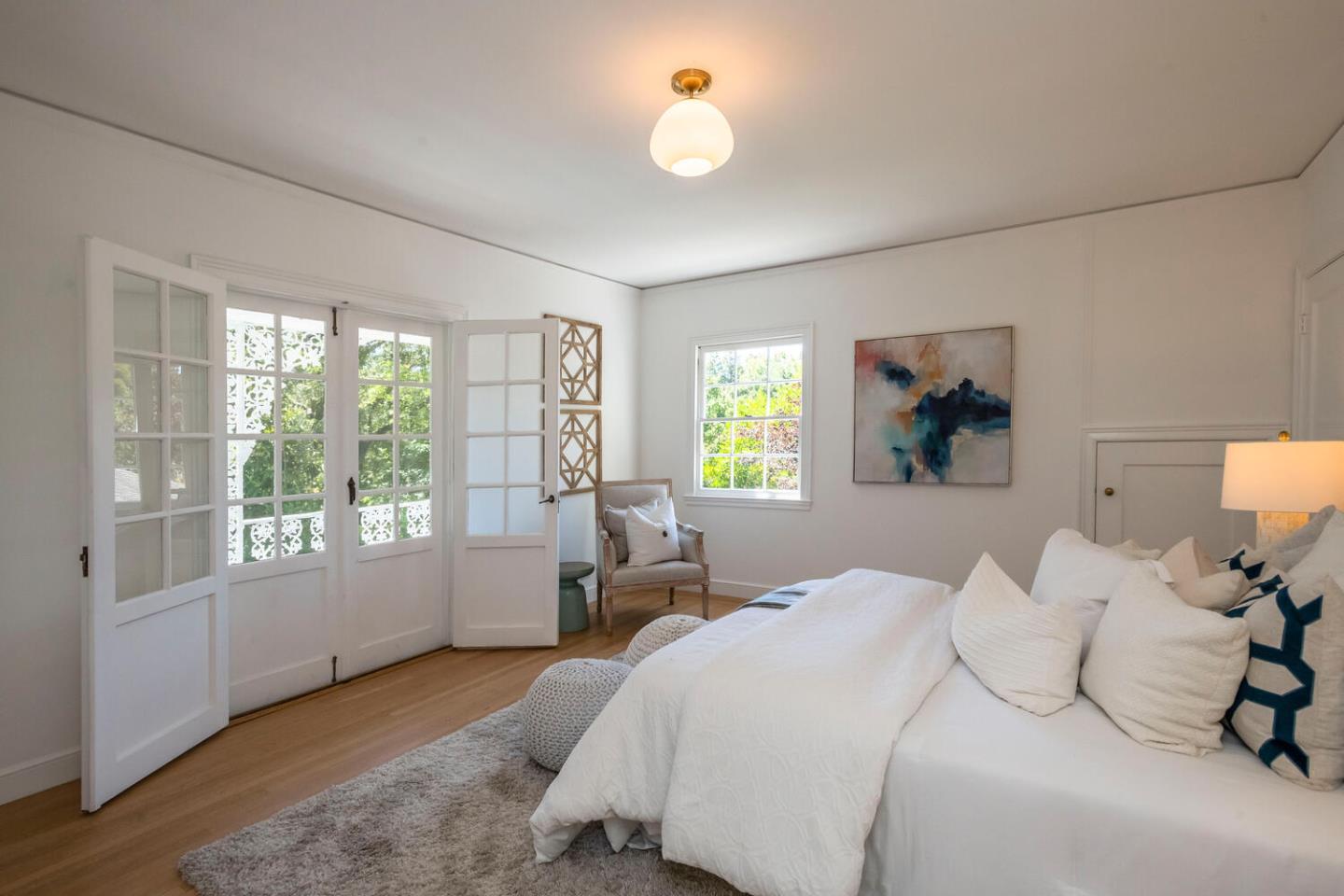 7 Windsor Drive Hillsborough, CA 94010 - Photo 24 of 57 a bedroom with a bed and a large window