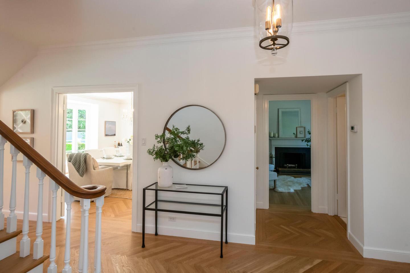 7 Windsor Drive Hillsborough, CA 94010 - Photo 3 of 57 a view of a hallway with wooden floor and a dining table