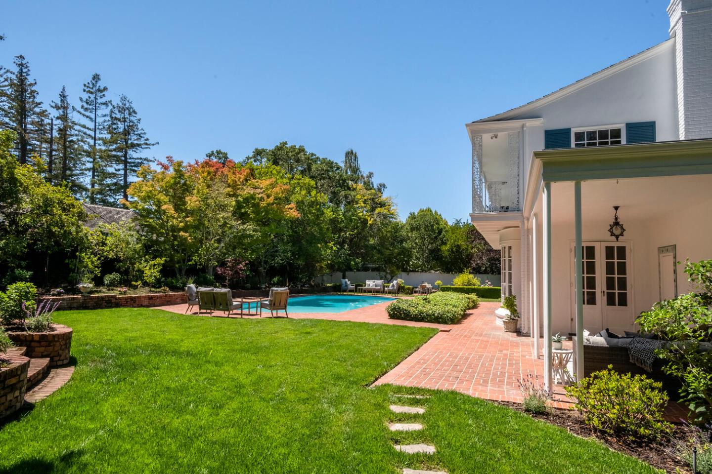 7 Windsor Drive Hillsborough, CA 94010 - Photo 39 of 57 a view of a house with big yard and a fountain