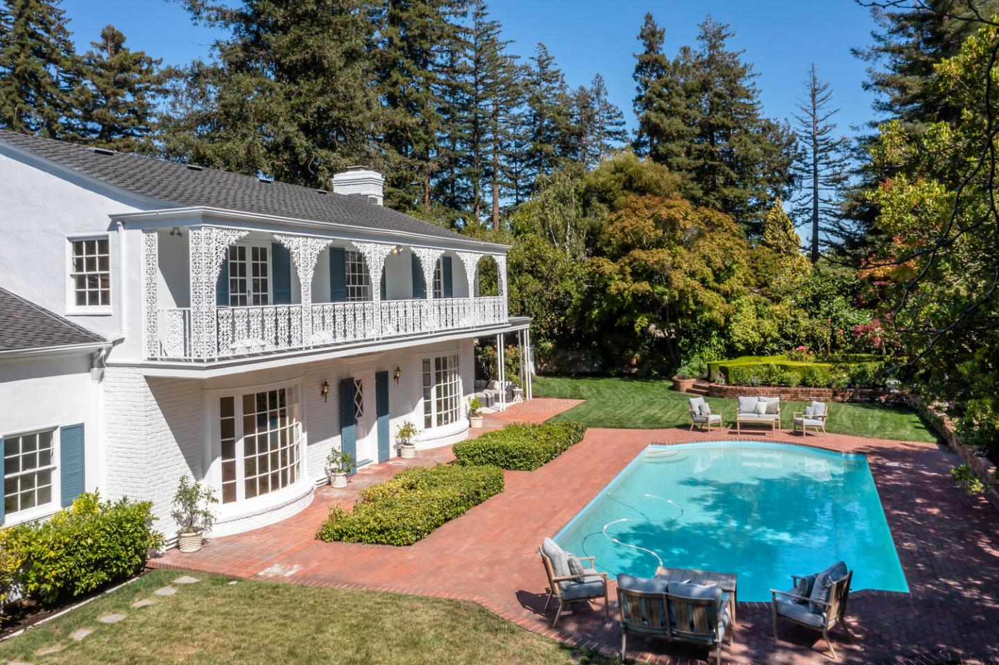 7 Windsor Drive Hillsborough, CA 94010 - Photo 42 of 57 a front view of a house with a yard table and chairs