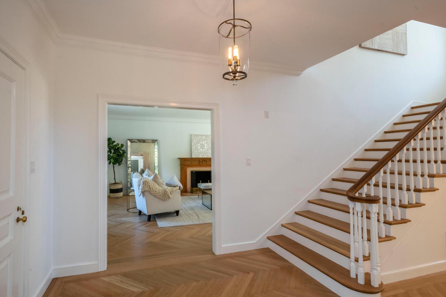 7 Windsor Drive Hillsborough, CA 94010 - Photo 5 of 57 a view of a hallway with couches and white walls