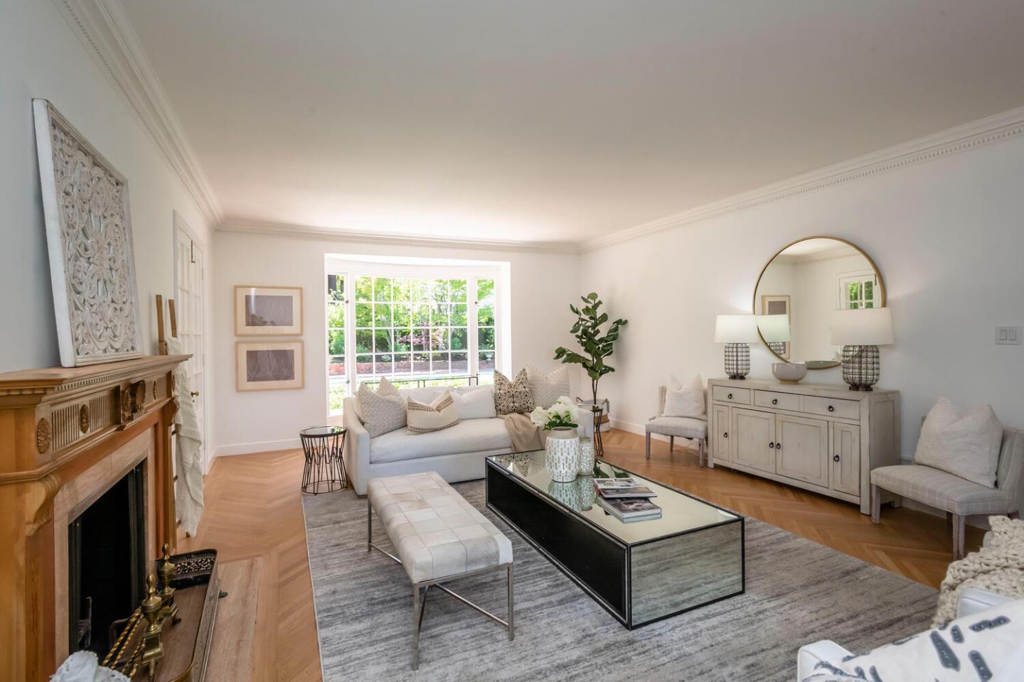 7 Windsor Drive Hillsborough, CA 94010 - Photo 9 of 57 a living room with furniture a fireplace a flat screen tv and next to a window